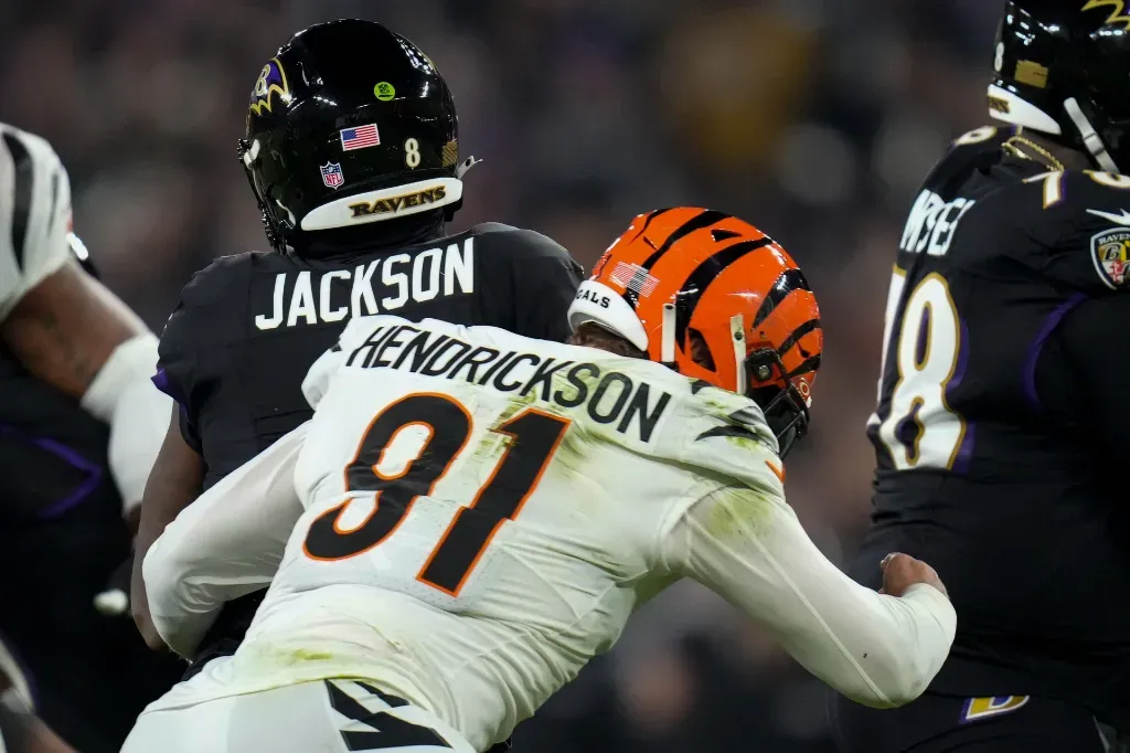 Cincinnati Bengals defensive end Trey Hendrickson (91) sacks Baltimore Ravens quarterback Lamar Jackson (8) in the first quarter of the NFL Week 11 game between the Baltimore Ravens and the Cincinnati Bengals at M&T Bank Stadium in Baltimore on Thursday, Nov. 16, 2023.