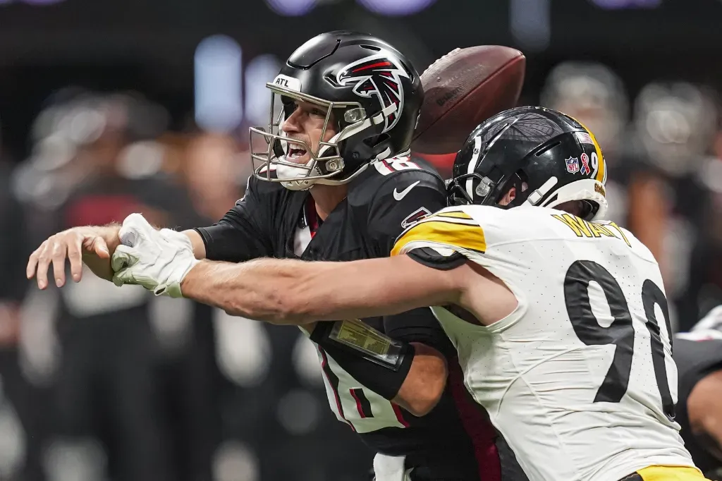Sep 8, 2024; Atlanta, Georgia, USA; Pittsburgh Steelers linebacker T.J. Watt (90) strips the ball from Atlanta Falcons quarterback Kirk Cousins (18) at Mercedes-Benz Stadium. Mandatory Credit: Dale Zanine-Imagn Images