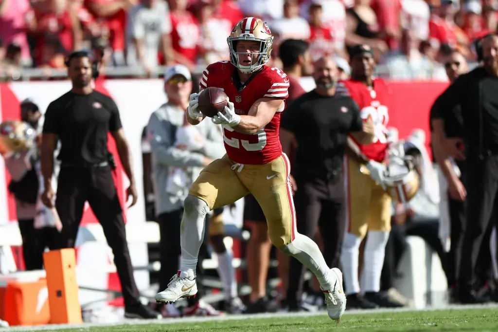Nov 10, 2024; Tampa, Florida, USA; San Francisco 49ers running back Christian McCaffrey (23) receives a pass against the Tampa Bay Buccaneers in the fourth quarter at Raymond James Stadium. Mandatory Credit: Nathan Ray Seebeck-Imagn Images