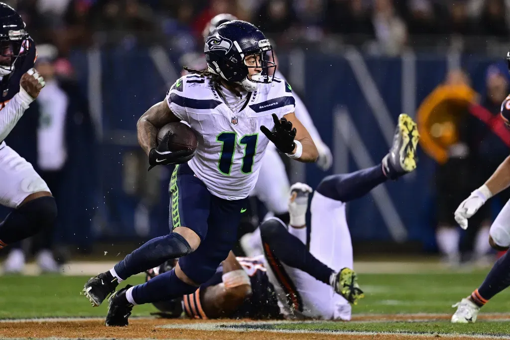 Dec 26, 2024; Chicago, Illinois, USA; Seattle Seahawks wide receiver Jaxon Smith-Njigba (11) runs after a catch against the Chicago Bears during the third quarter at Soldier Field. Mandatory Credit: Daniel Bartel-Imagn Images