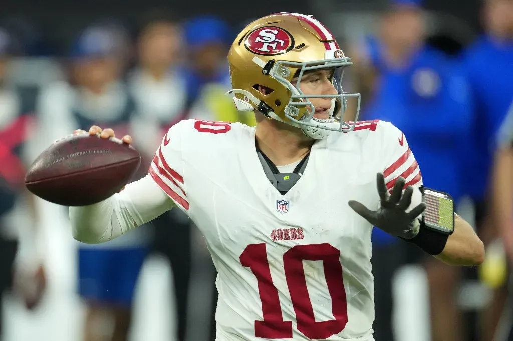 football quarterback throwing pass