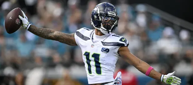 Jaxon Smith Njigba - Portrait with Seattle Seahawks jersey.