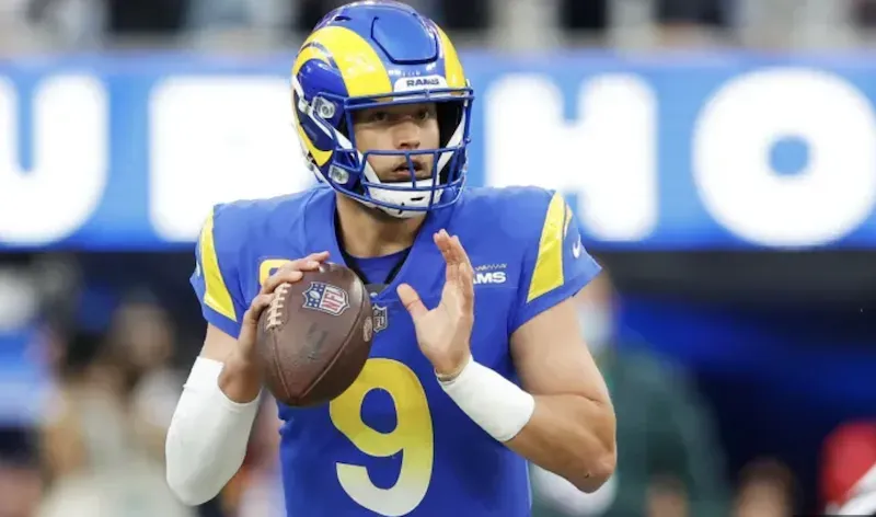 Matthew Stafford - Portrait with football in action.