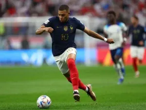 Kylian Mbappe - Portrait with soccer action.