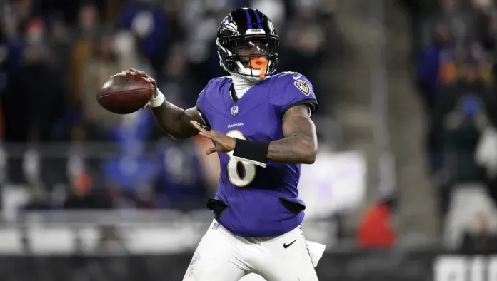 Lamar Jackson - Portrait with football in action.